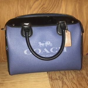 Adorable blue coach purse with black\flower accent